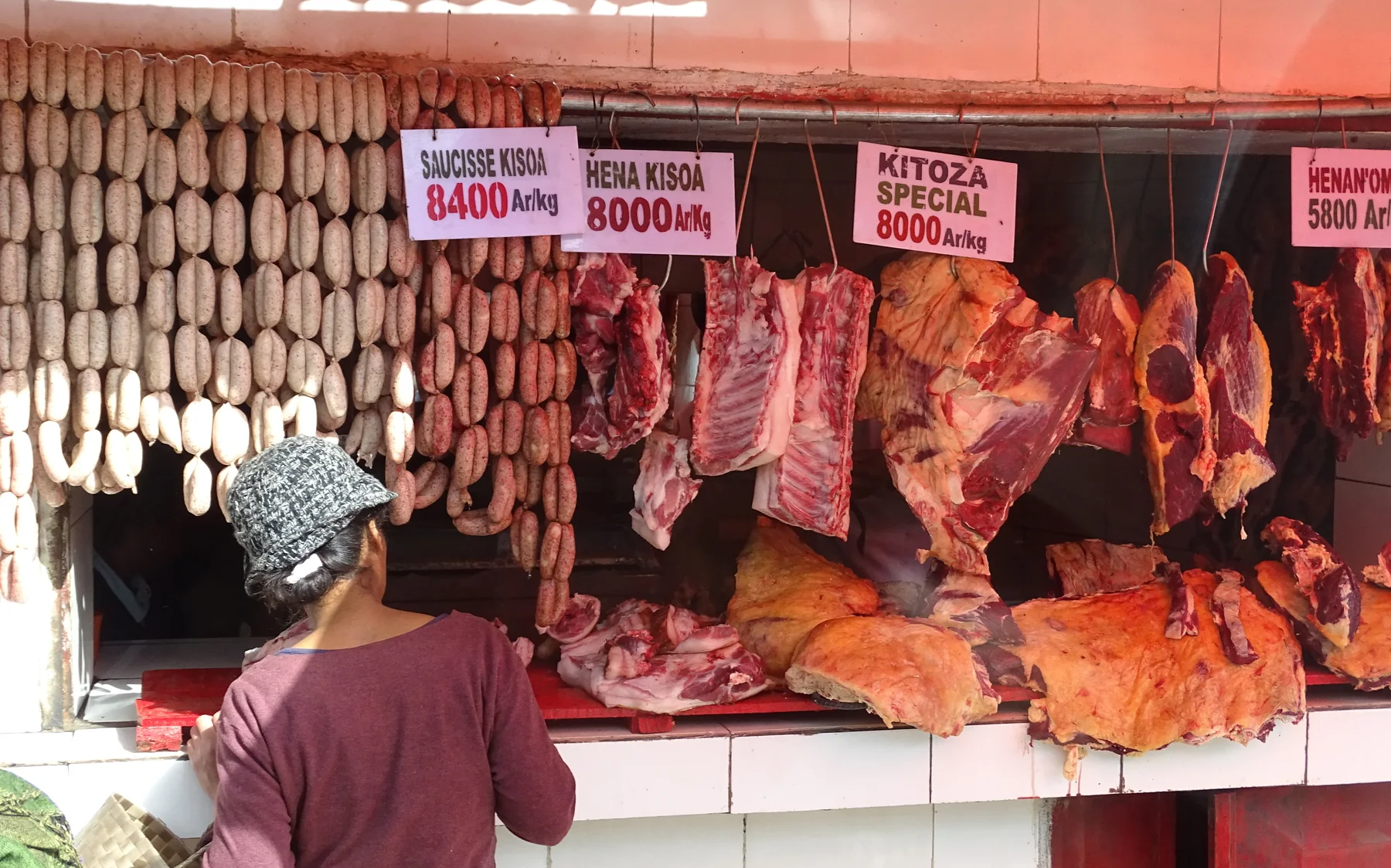 An archival photograph of a meat stall in Antananarivo