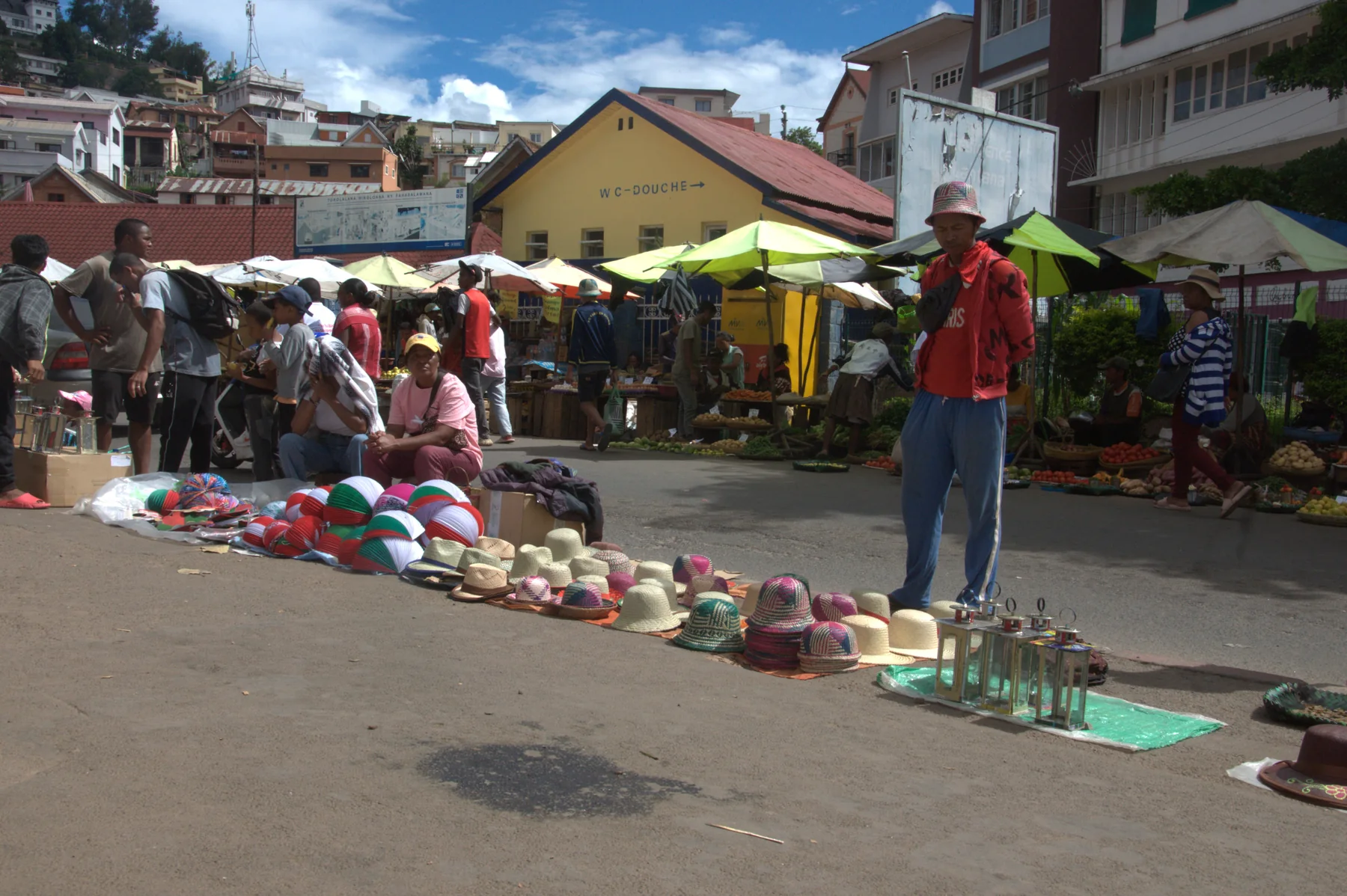Hats and goods displayed at Mahamasina market